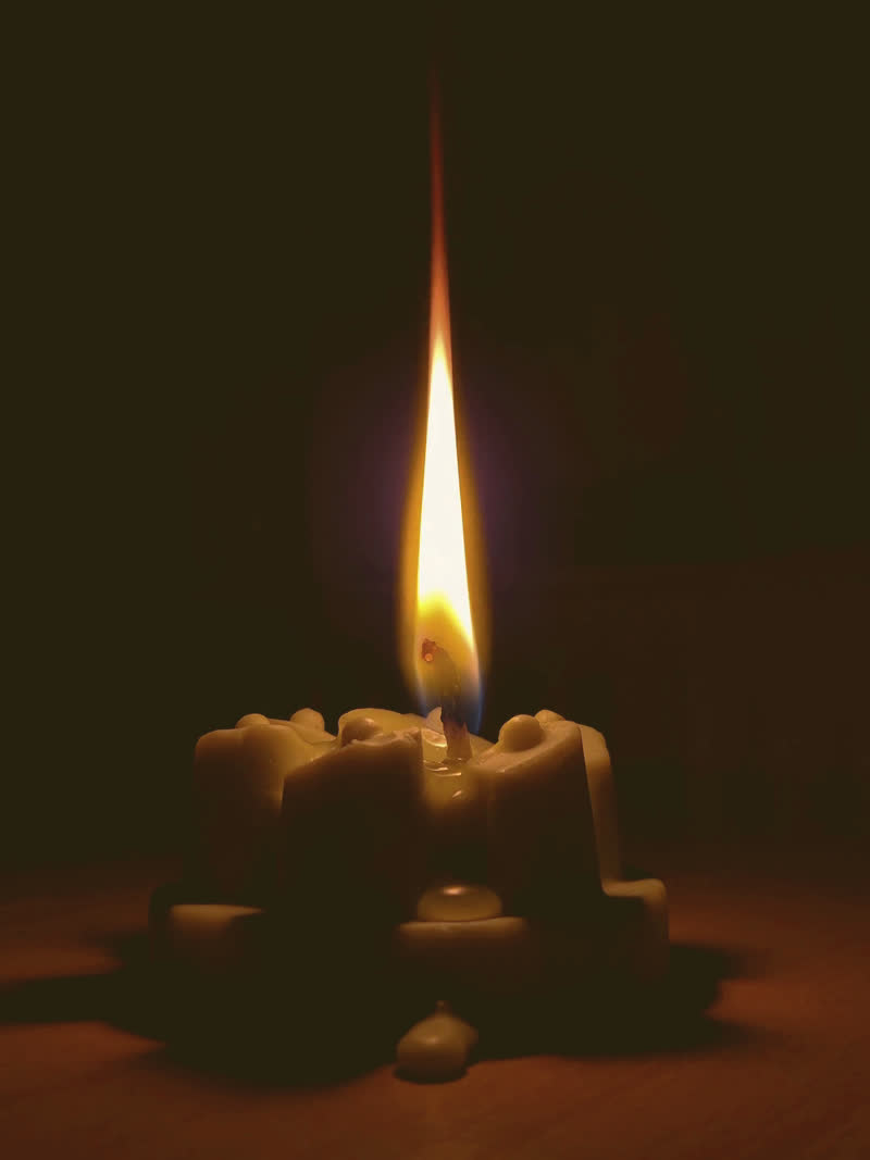The still that carried "i sit with the flame"