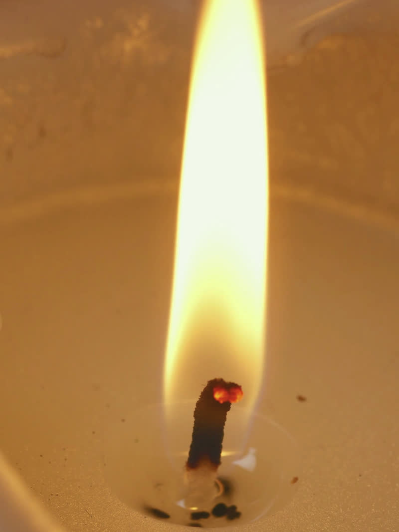 The still that carried "i sit with the flame"